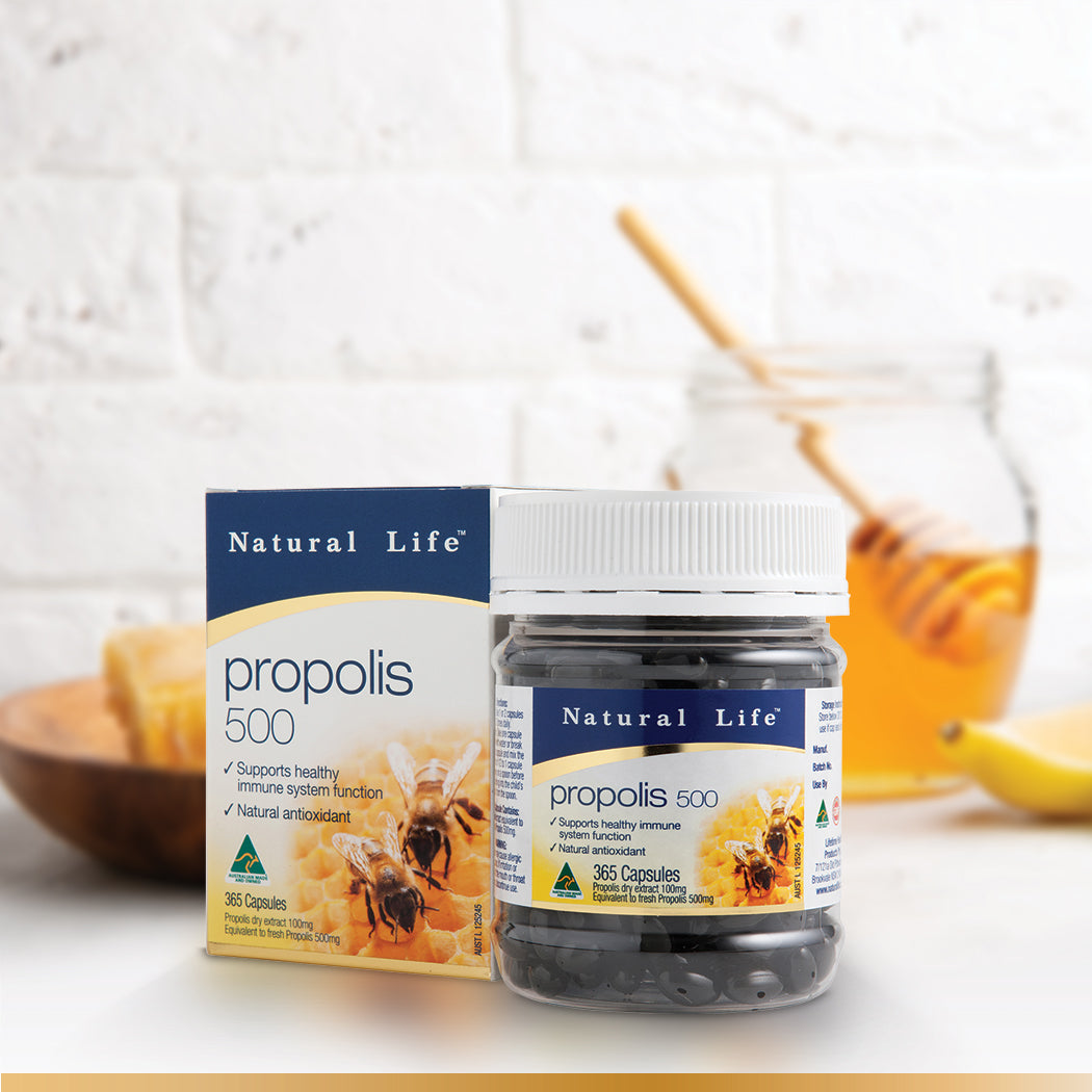Natural Life Propolis 500 Box and Bottle with pot of honey in the background